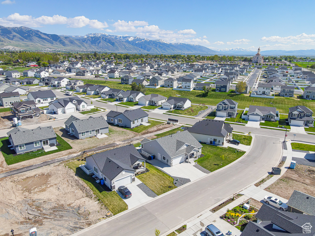 Aerial view of residential area featuring mountains