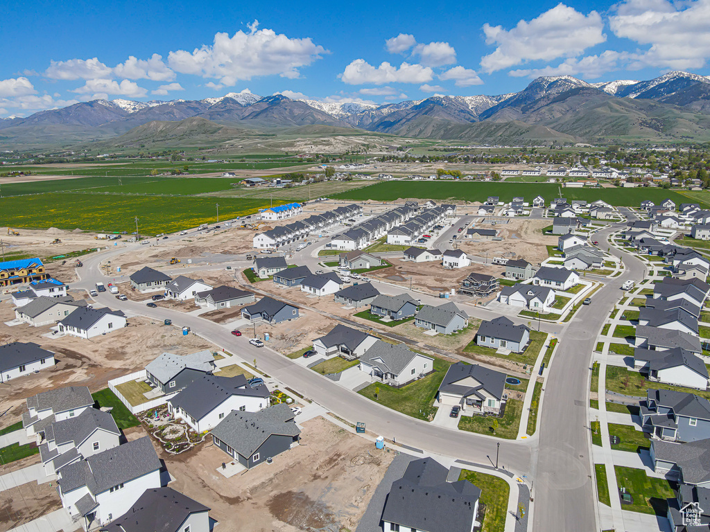 Aerial perspective of suburban area featuring a mountainous background