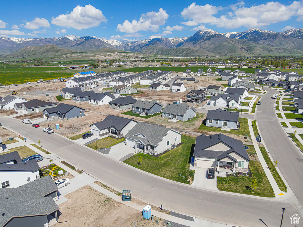 Aerial view of residential area featuring mountains