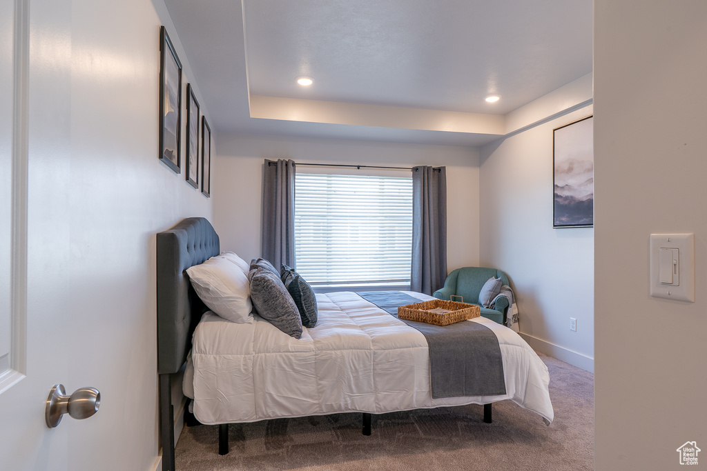 Carpeted bedroom with baseboards and recessed lighting