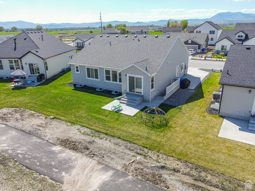 Aerial view of residential area with a mountainous background