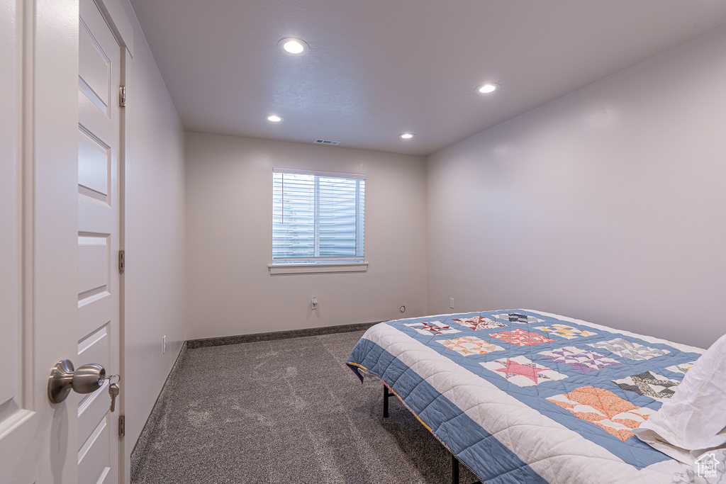 Bedroom featuring carpet flooring, recessed lighting, and baseboards