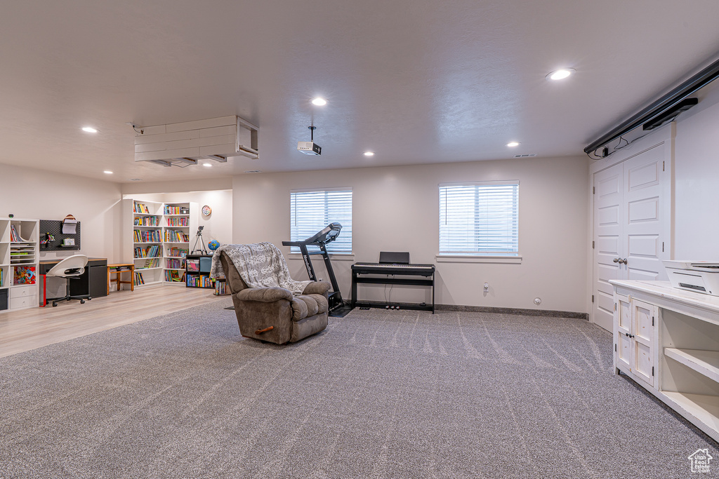 Living area featuring recessed lighting, carpet flooring, and baseboards