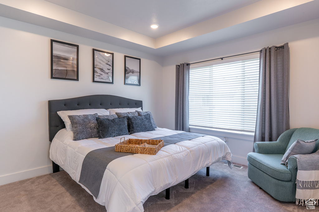 Carpeted bedroom featuring baseboards and recessed lighting