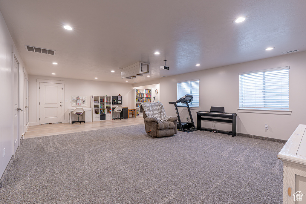 Sitting room featuring carpet, recessed lighting, and baseboards