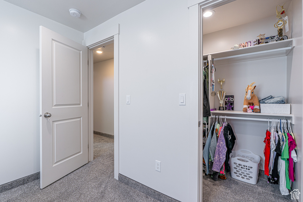 Carpeted bedroom featuring recessed lighting and baseboards