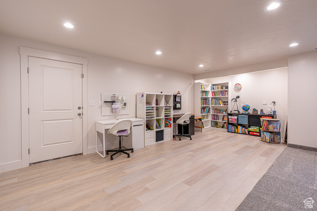 Office space with recessed lighting, wood finished floors, and baseboards