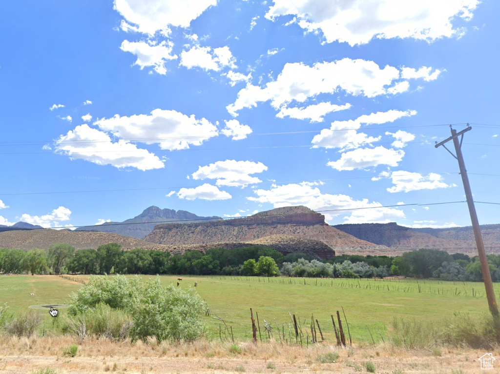 View of mountain background featuring rural landscape