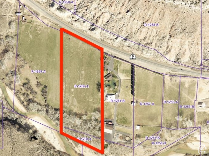 Aerial map of property and surrounding area featuring property boundaries highlighted