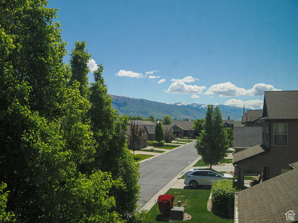 View of mountain backdrop featuring nearby suburban area
