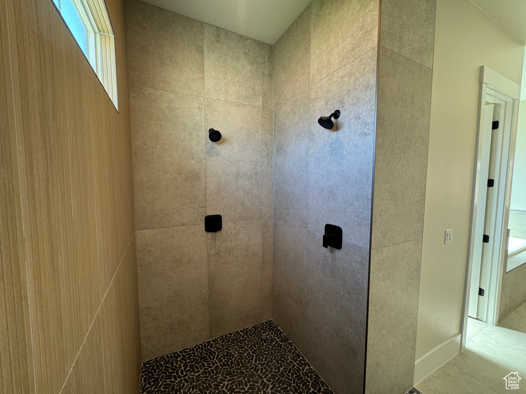 Full bathroom featuring tiled shower