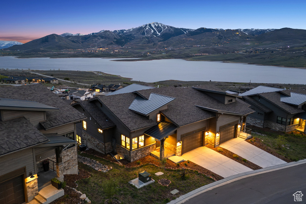 View of subject property featuring a water and mountain view