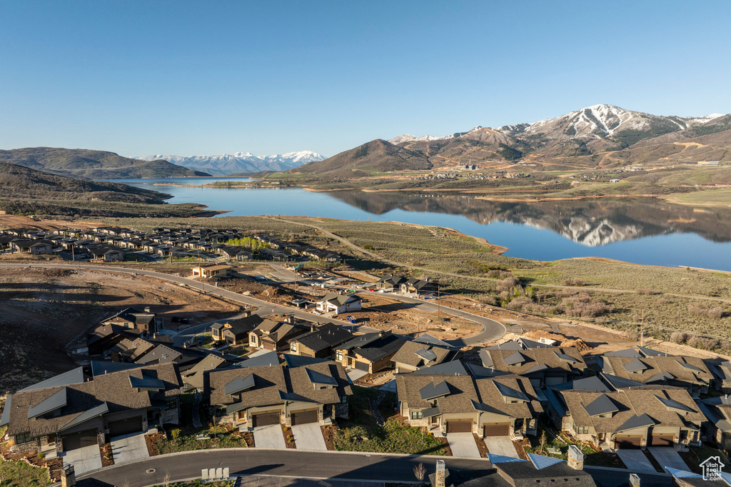 View of mountain background with a nearby body of water and nearby suburban area