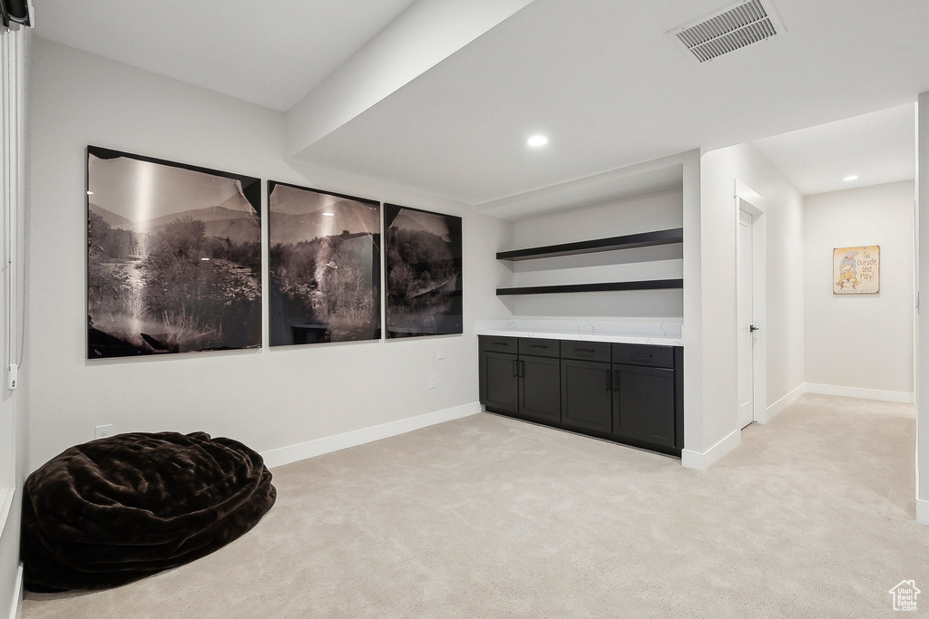 Unfurnished room with light carpet, baseboards, and recessed lighting