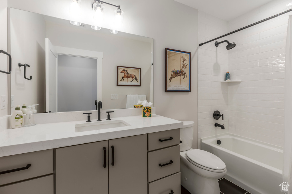Full bathroom with vanity, toilet, and bathtub / shower combination