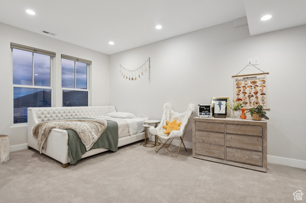 Bedroom featuring light carpet, baseboards, and recessed lighting