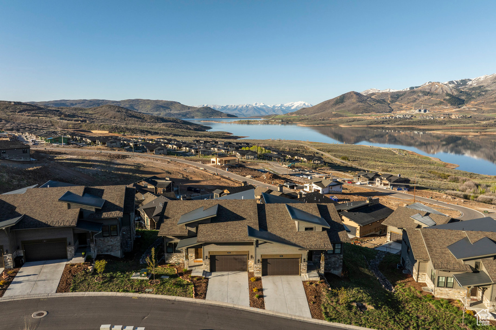 Aerial perspective of suburban area featuring a water and mountain view