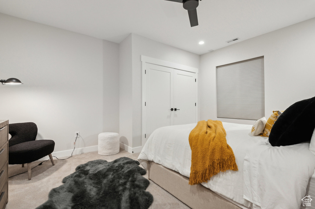 Carpeted bedroom featuring baseboards, ceiling fan, a closet, and recessed lighting