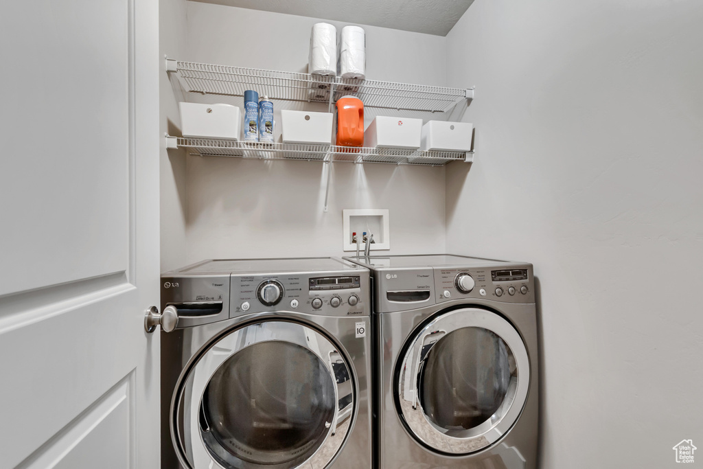 Laundry area featuring laundry area and washing machine and dryer