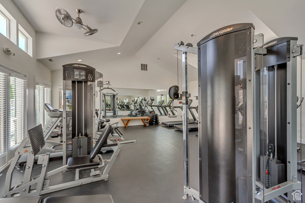 Gym with recessed lighting and high vaulted ceiling