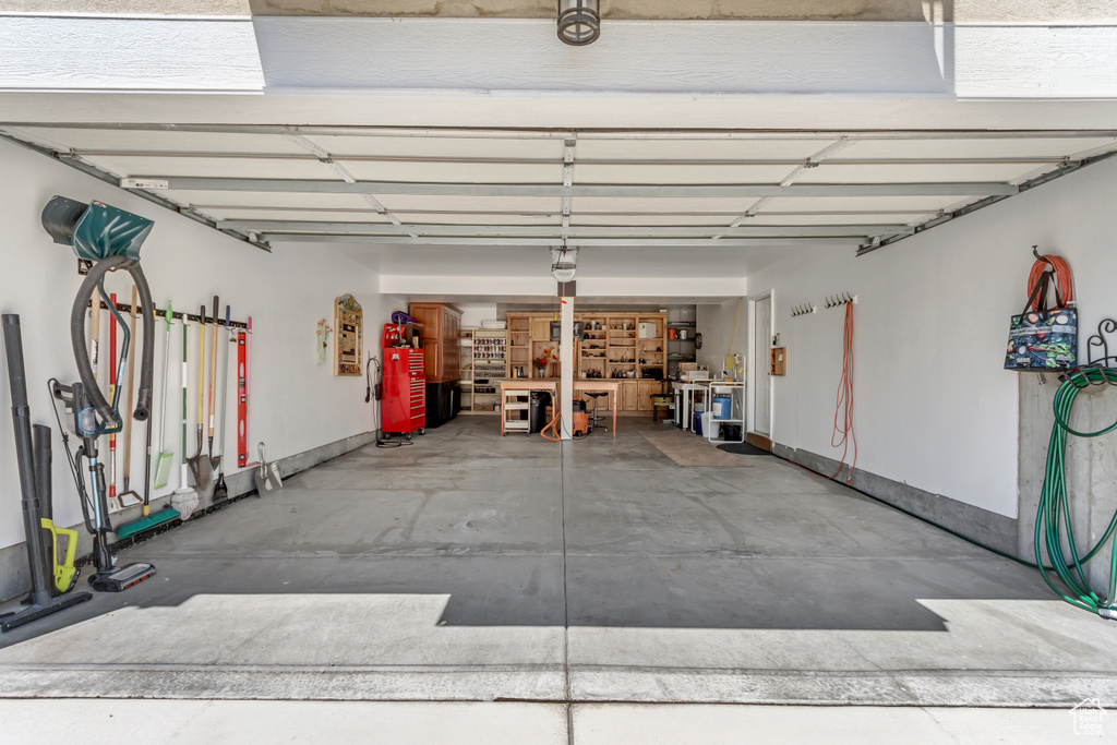 Garage featuring baseboards