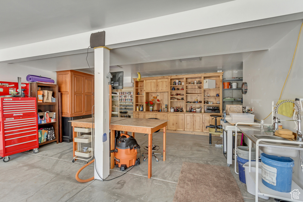 Finished basement with a workshop area