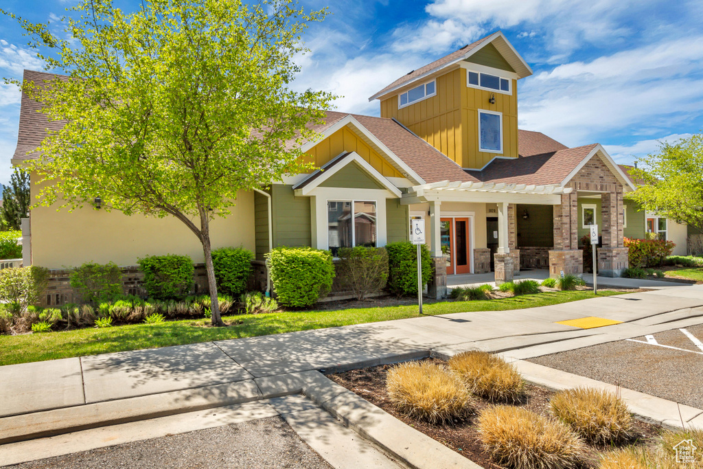 Craftsman-style house featuring board and batten siding and covered porch