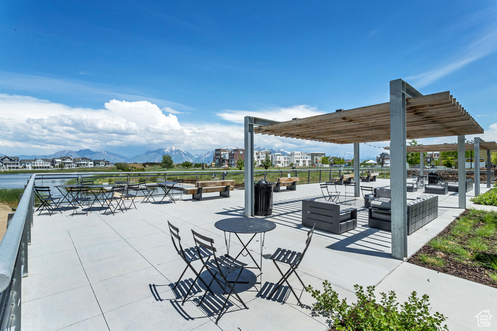 View of patio with outdoor lounge area and a mountain view
