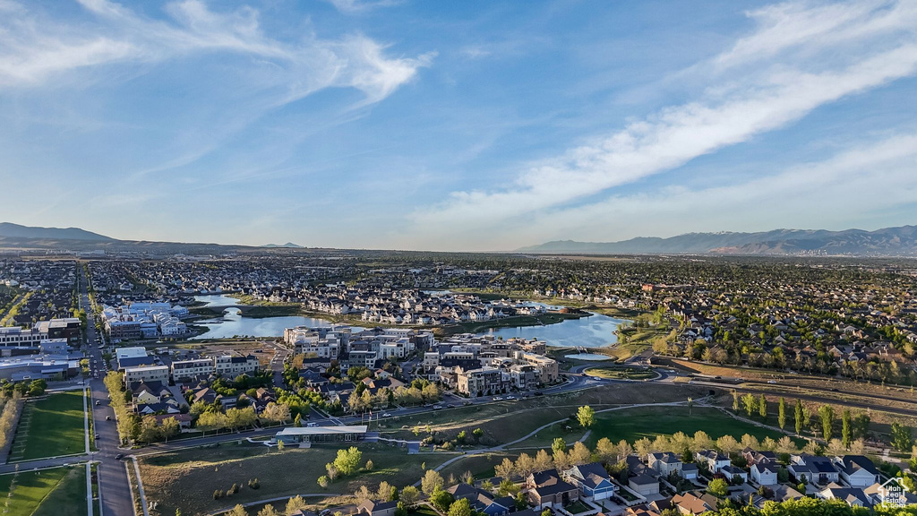Aerial perspective of suburban area with a water and mountain view