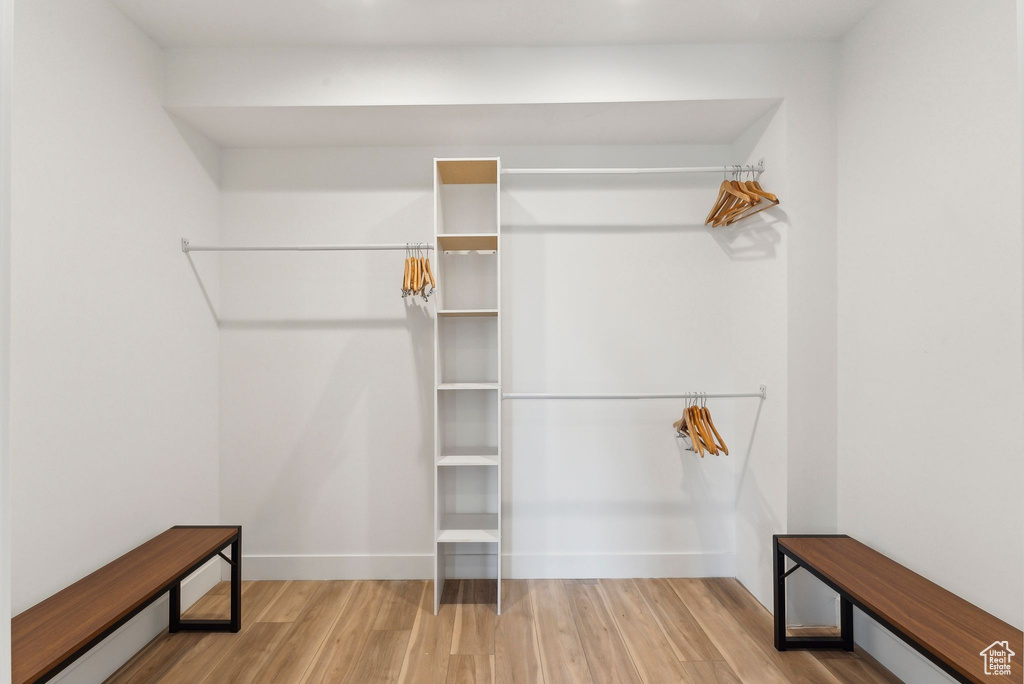 Walk in closet featuring wood finished floors