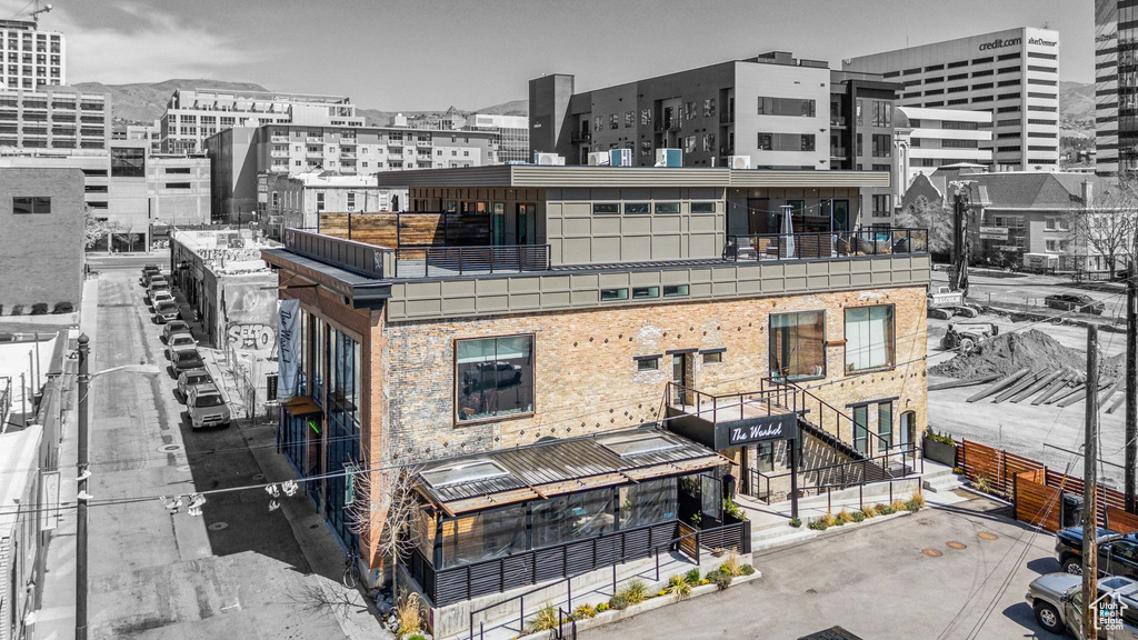 View of building exterior featuring a city view
