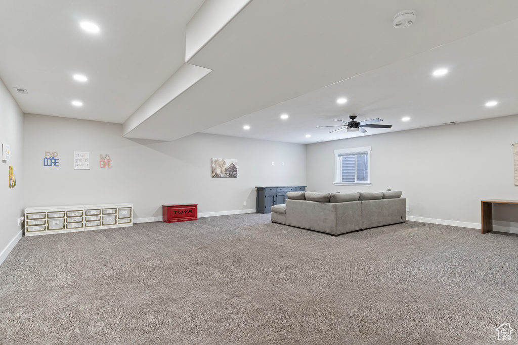 Living room featuring ceiling fan, recessed lighting, carpet floors, and baseboards
