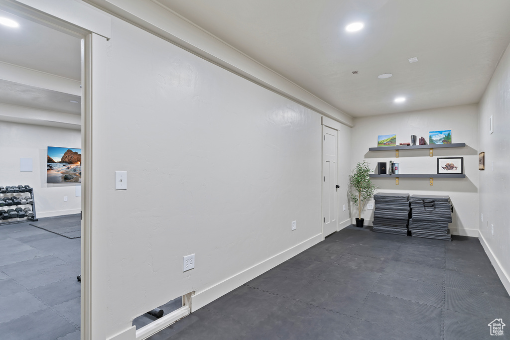Interior space featuring baseboards and recessed lighting