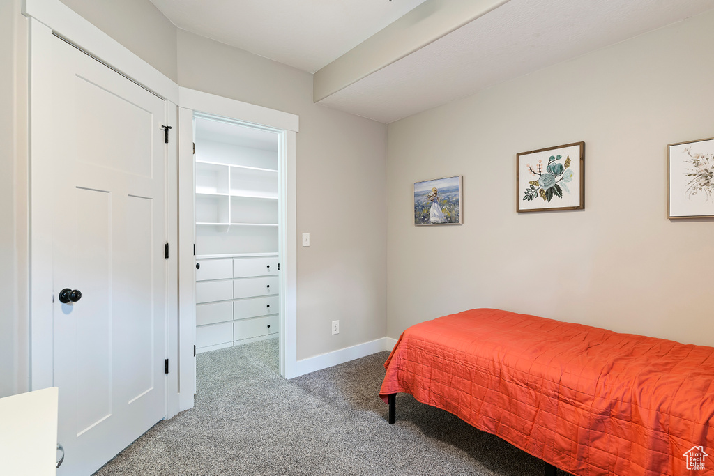 Bedroom with carpet and baseboards