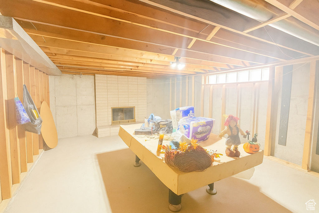Basement with a brick fireplace