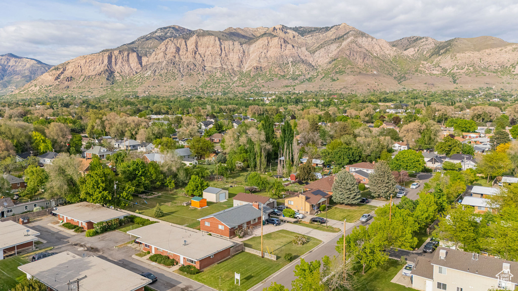 Aerial view of residential area featuring a mountainous background