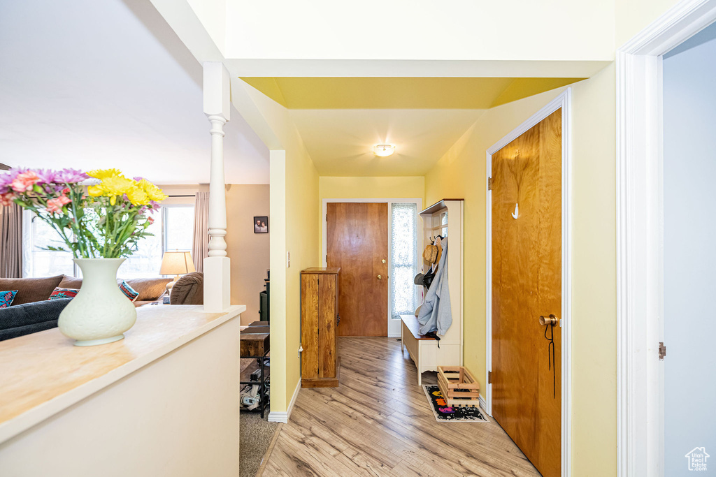 Hall featuring light wood-style floors and baseboards