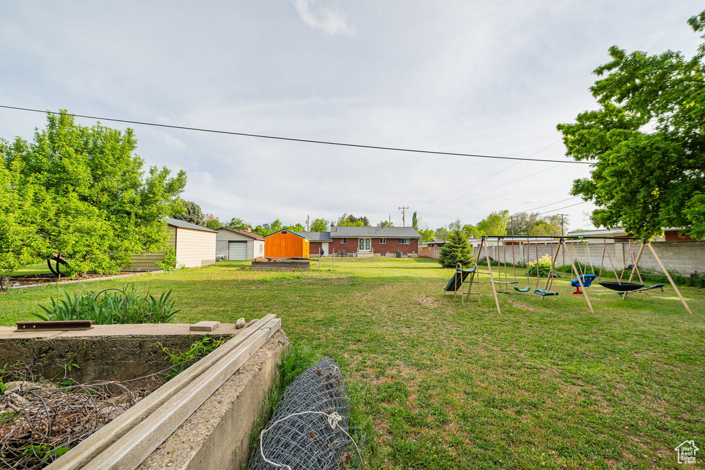 View of yard featuring a playground