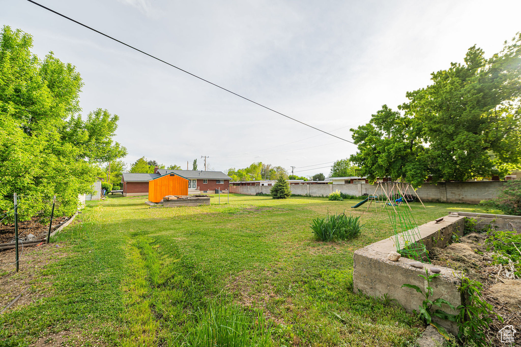 View of yard with a playground