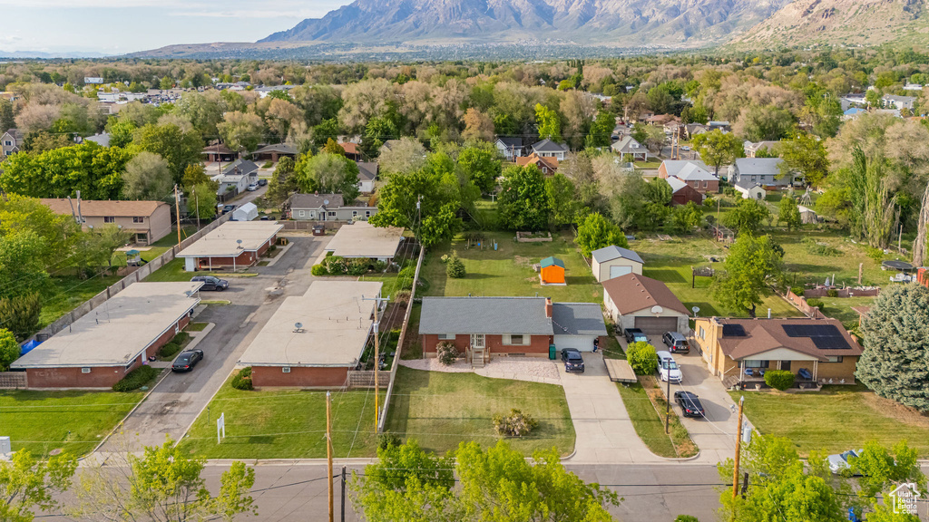 Aerial perspective of suburban area featuring a mountainous background