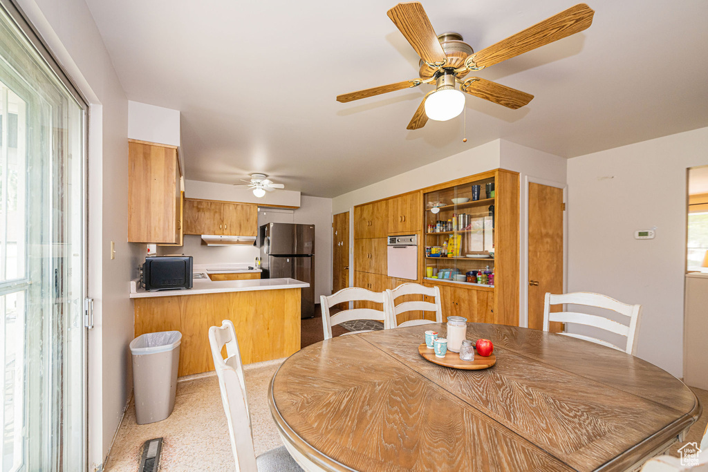 Dining area featuring a ceiling fan
