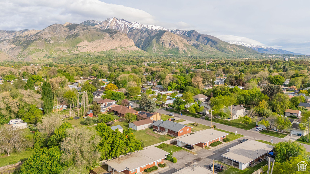 Aerial perspective of suburban area with a mountain backdrop
