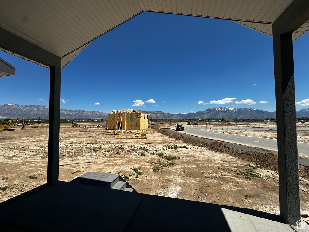 View of yard with a mountain view, a patio, and a view of countryside