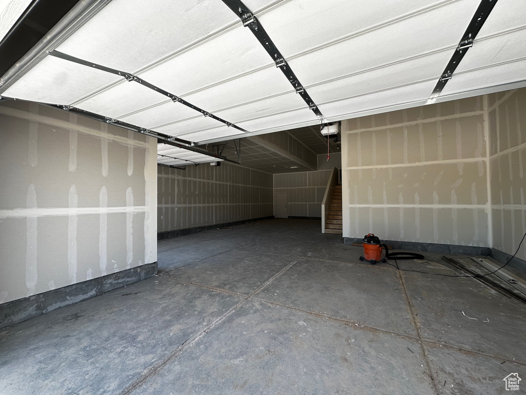 Garage featuring a garage door opener