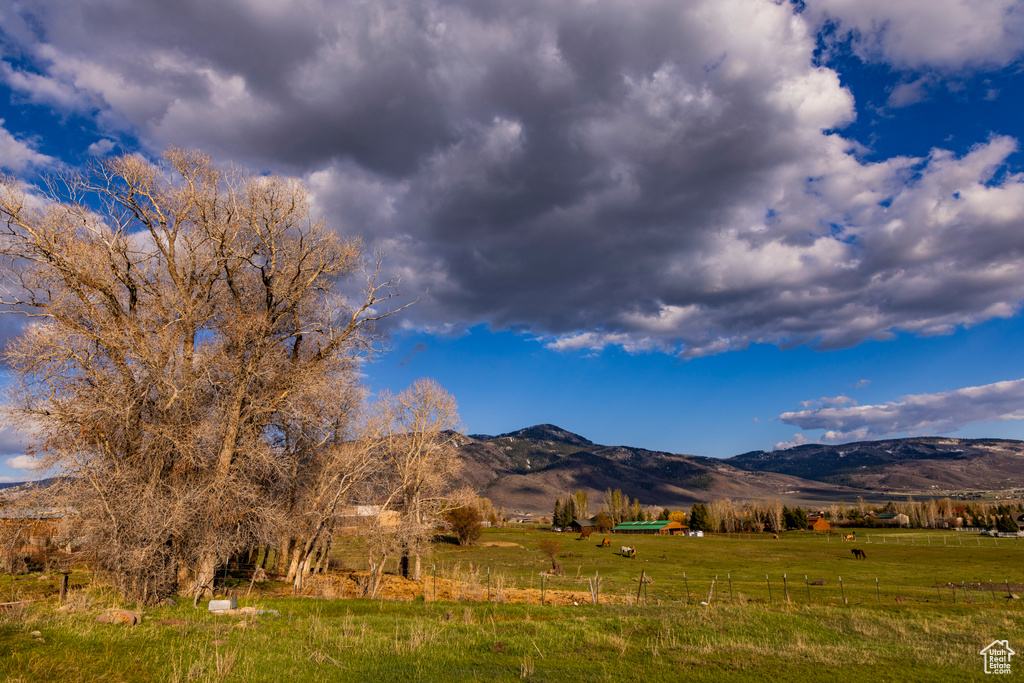 View of mountain backdrop featuring rural landscape