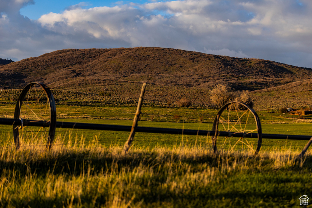 View of mountain backdrop with rural landscape and a pastoral area