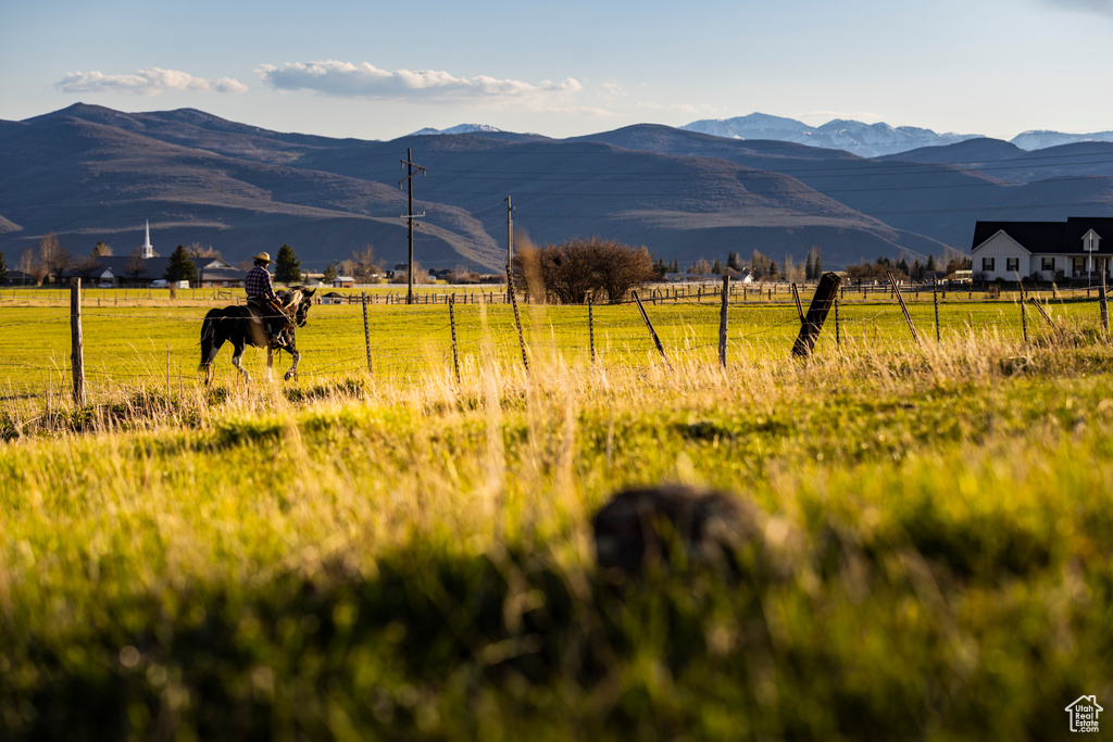 View of mountain backdrop featuring rural landscape and a pastoral area