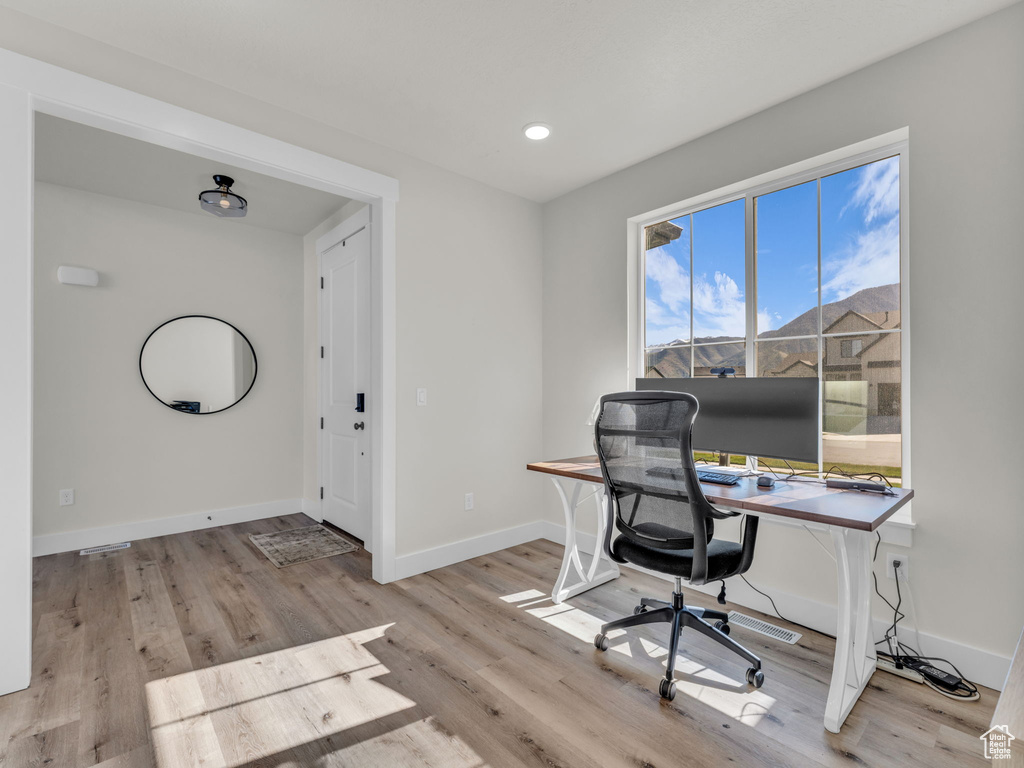 Office area featuring wood finished floors, baseboards, and recessed lighting