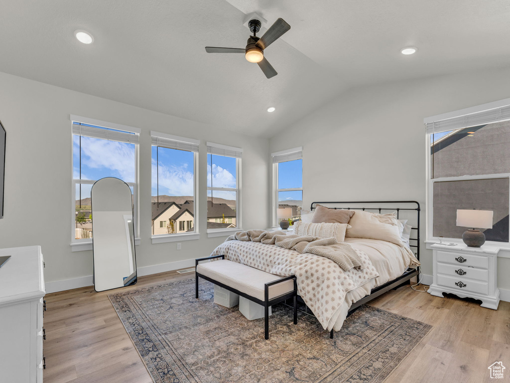 Bedroom featuring vaulted ceiling, light wood-style flooring, recessed lighting, a ceiling fan, and baseboards