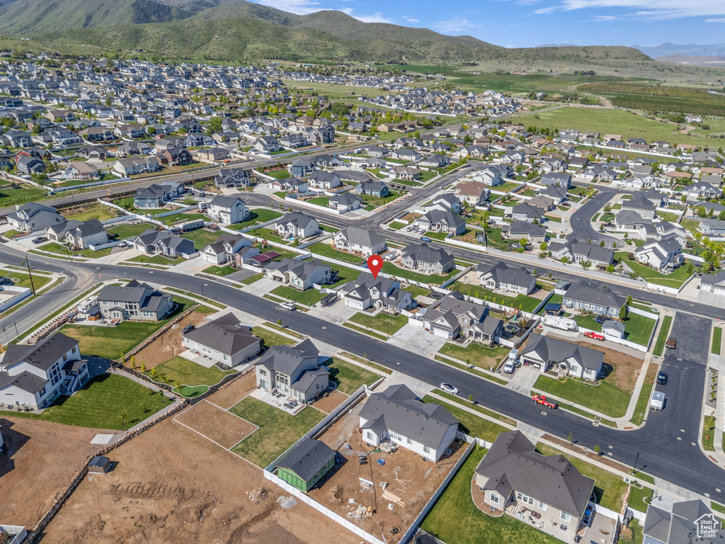 View of property location featuring a mountain backdrop and nearby suburban area